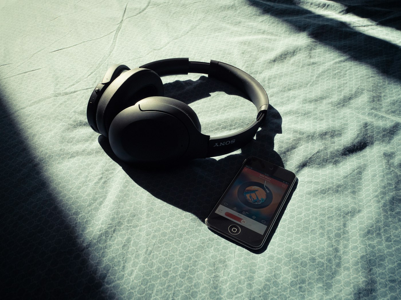 Headphones and phone for downloading a SoundCloud playlist as MP3