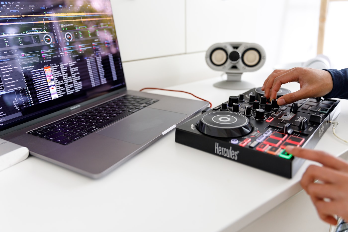 Laptop and DJ controller for converting a SoundCloud playlist to MP3